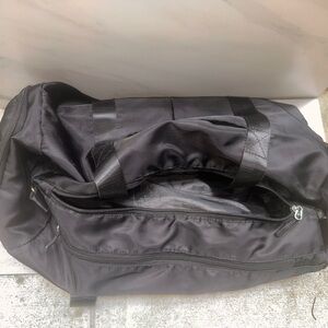 Travel Bag: Large black duffle bag travel size